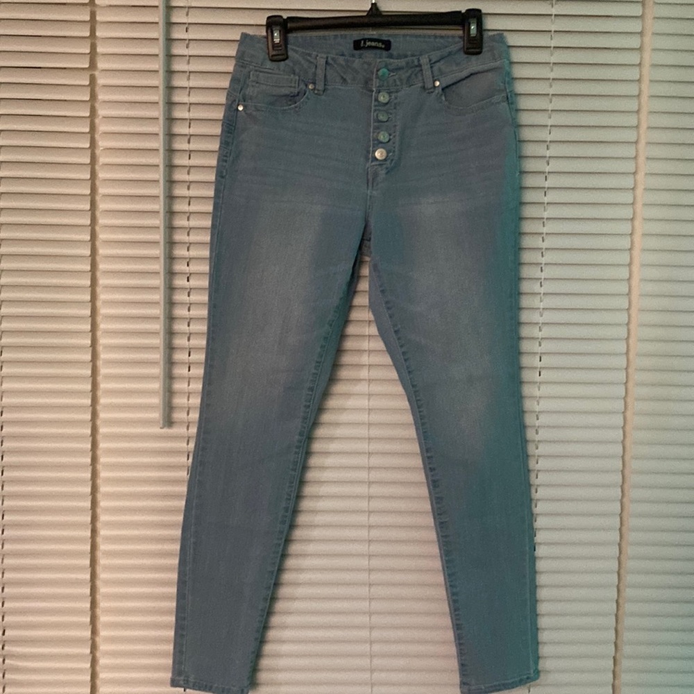 Women’s light washed button fly jeans